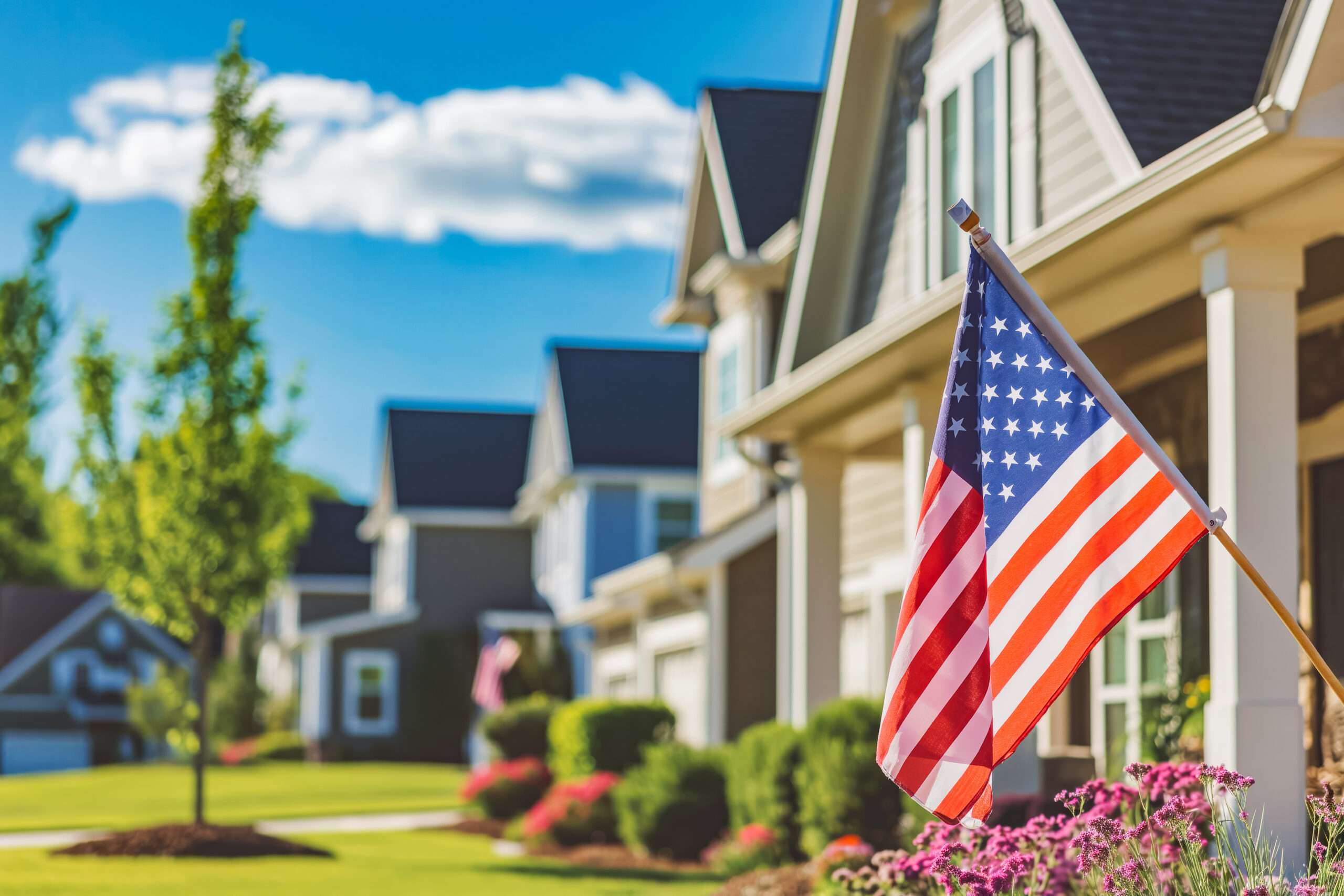 american flag on a modern american house memorial day the flag is flown on a national holiday | texas veteran va home loans va construction loan